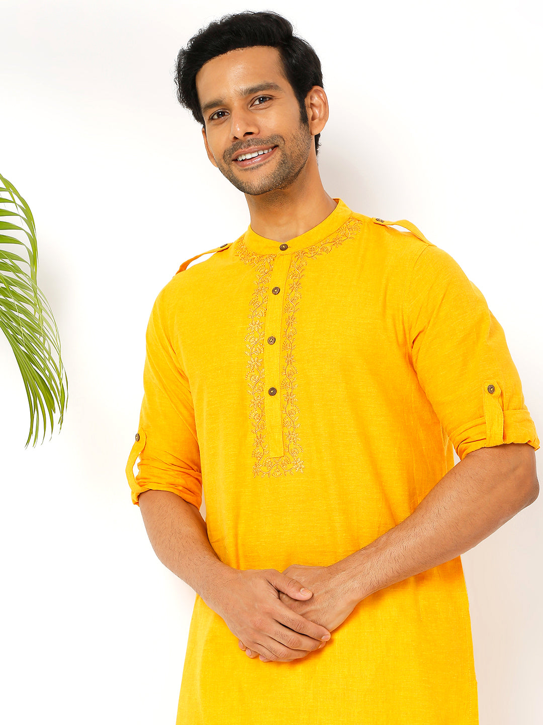 Men's golden yellow cotton knee-length kurta, fabric texture detail.