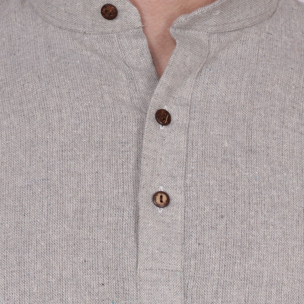 Close-up of In-Sattva's men's gray handmade khadi cotton thigh-length kurta tunic, showing the short button placket, brown buttons and textured khadi cotton fabric.
