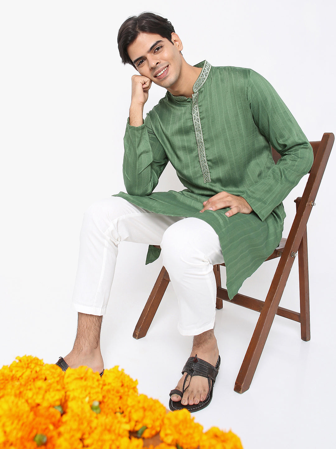 Men's green embroidered cotton knee-length kurta, collar and neckline detail.