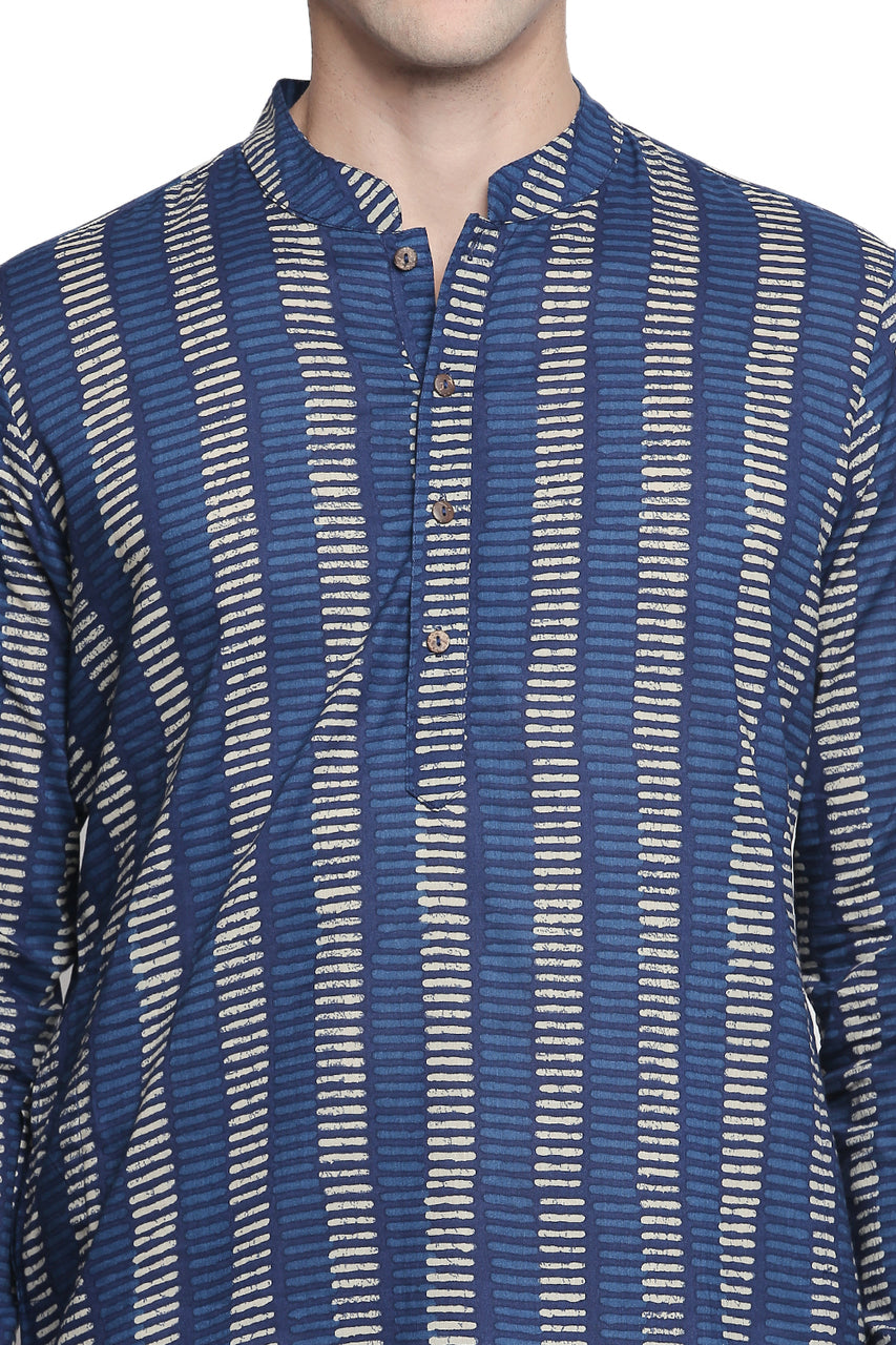 Close-up of In-Sattva's men's indigo block print cotton thigh-length kurta tunic, showing the band collar, button placket and cream block print pattern on indigo cotton.