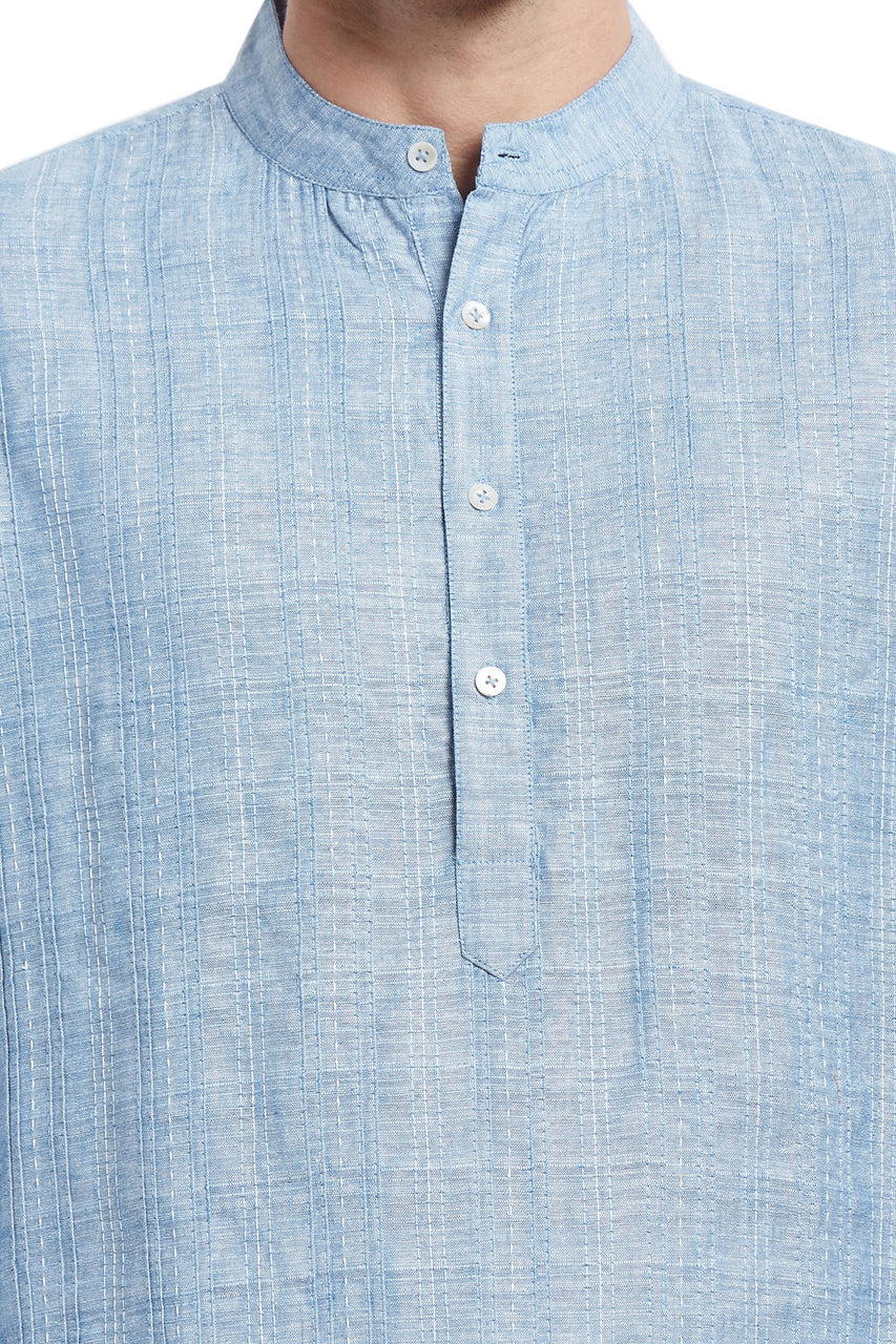 Men's light blue textured cotton blend knee-length kurta, close-up detail.