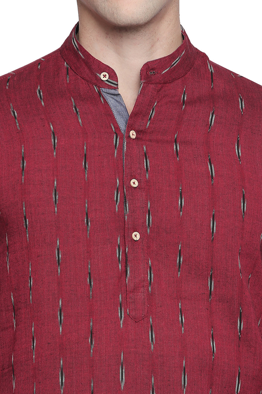Men's red printed cotton band collar knee-length kurta, side view.