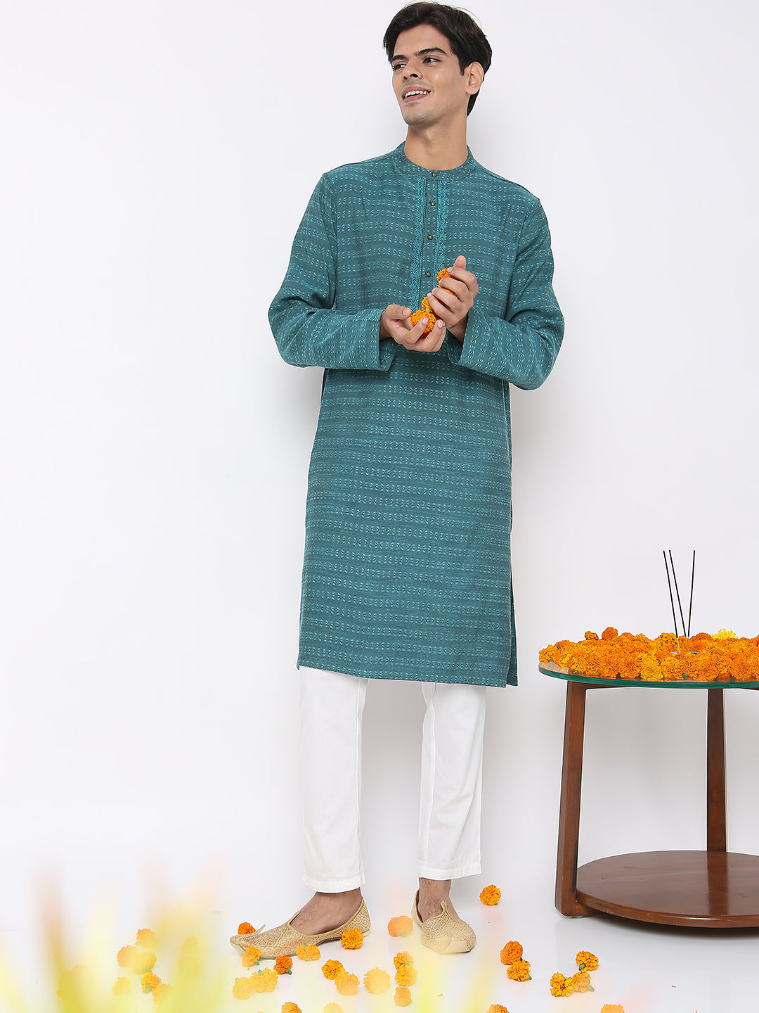 Men's turquoise embroidered cotton knee-length kurta, close-up detail.