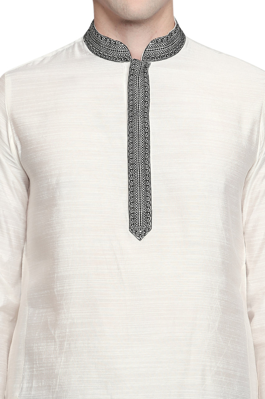 Men's white embroidered cotton blend knee-length kurta, side view.