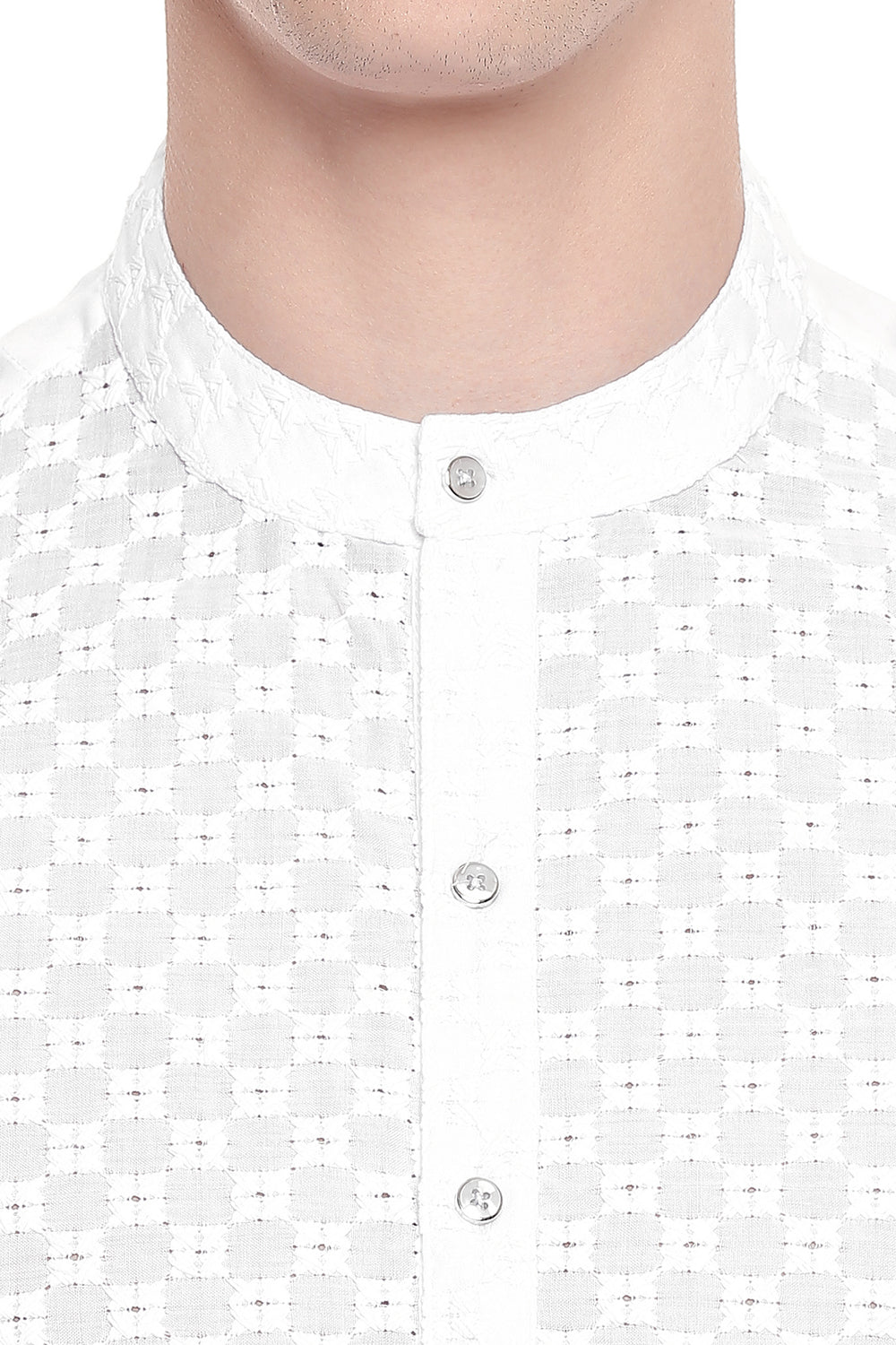 Men's white hand-embroidered cotton knee-length kurta, close-up detail.