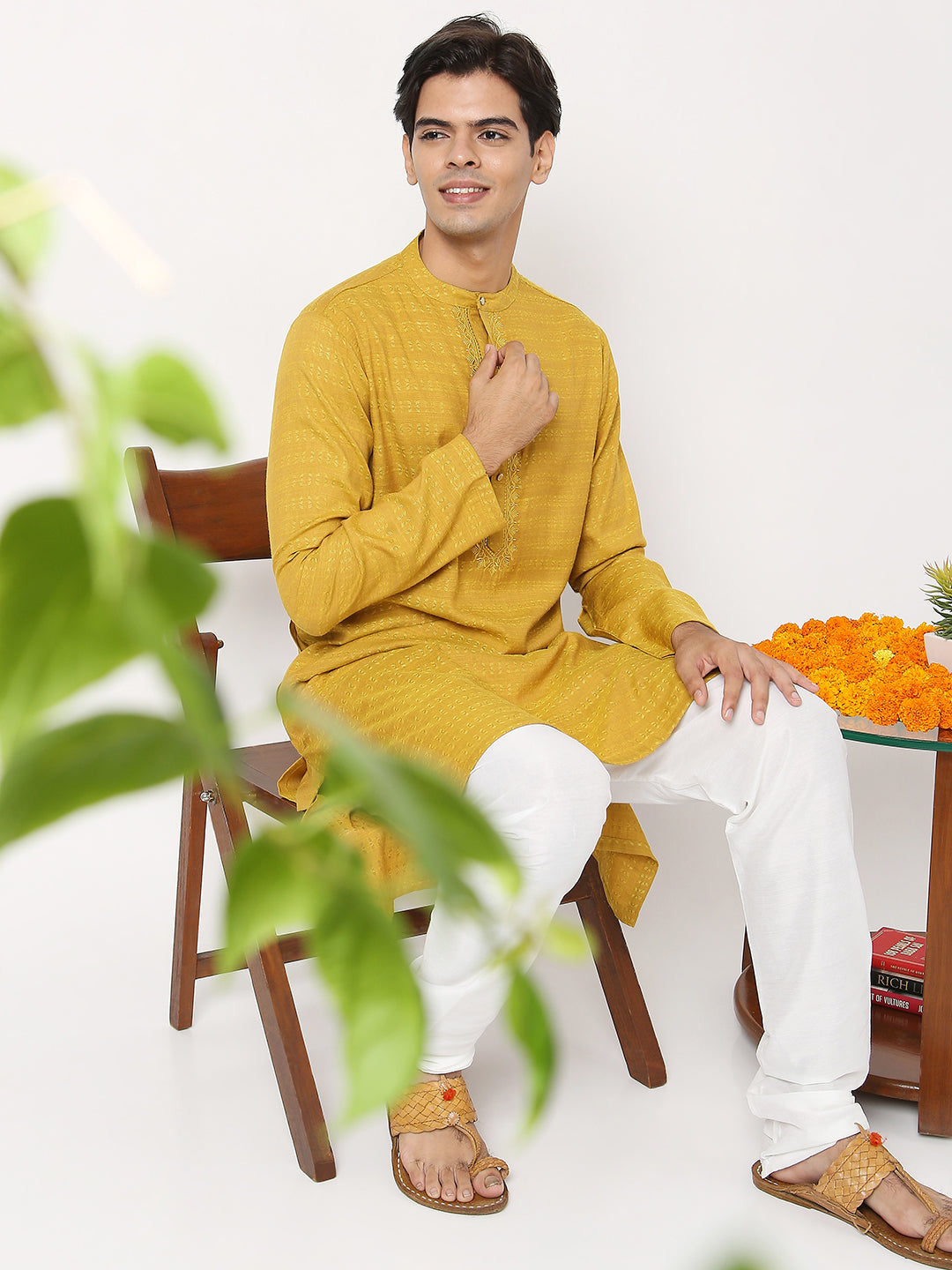 Men's yellow embroidered cotton knee-length kurta, collar and neckline detail.