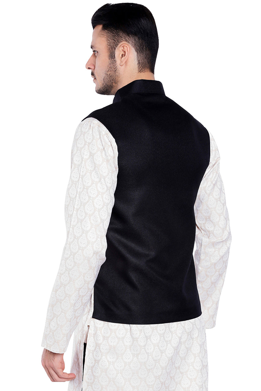 Back view of men's black three-pocket Nehru vest, highlighting functional, classic wedding guest style.