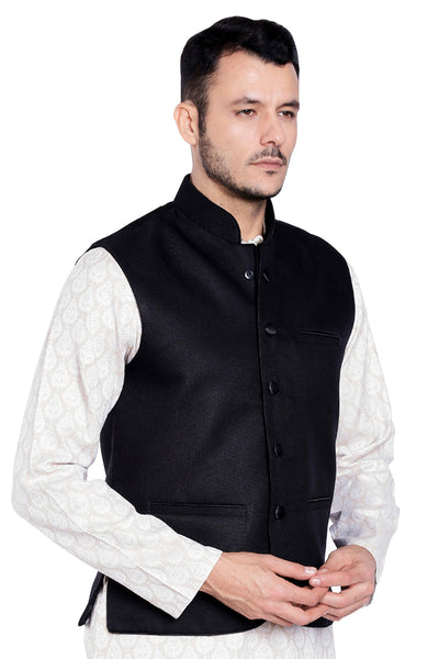 Right-side view of men's black three-pocket Nehru vest, highlighting functional, classic wedding guest style.
