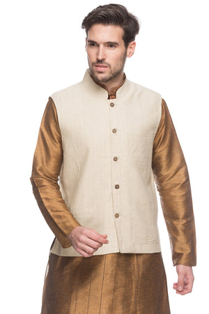 Front view of Shatranj men's natural-tone Mandarin collar vest, highlighting wedding guest style with ethnic details.