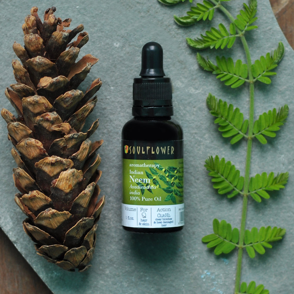 Soulflower Neem Essential Oil for scalp and skin care product flat-lay image