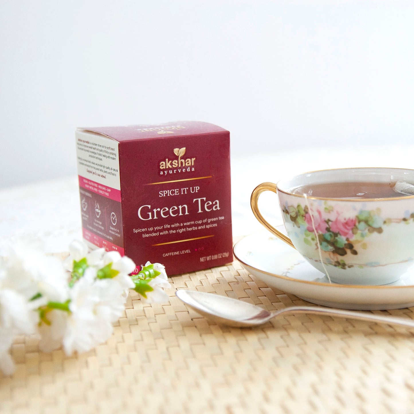 Akshar Ayurveda Spice It Up Green Herbal Tea, 10 tea bags brewed tea product lifestyle image