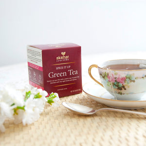 Akshar Ayurveda Spice It Up Green Herbal Tea, 10 tea bags brewed tea product lifestyle image