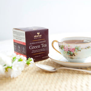 Akshar Ayurveda Super Oxidant Green Herbal Tea, 10 tea bags brewed tea product lifestyle image