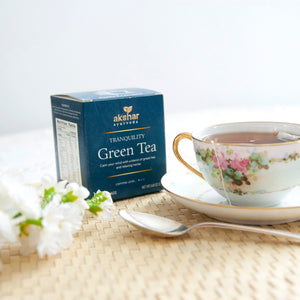 Akshar Ayurveda Tranquility Green Herbal Tea, 10 tea bags brewed tea product lifestyle image