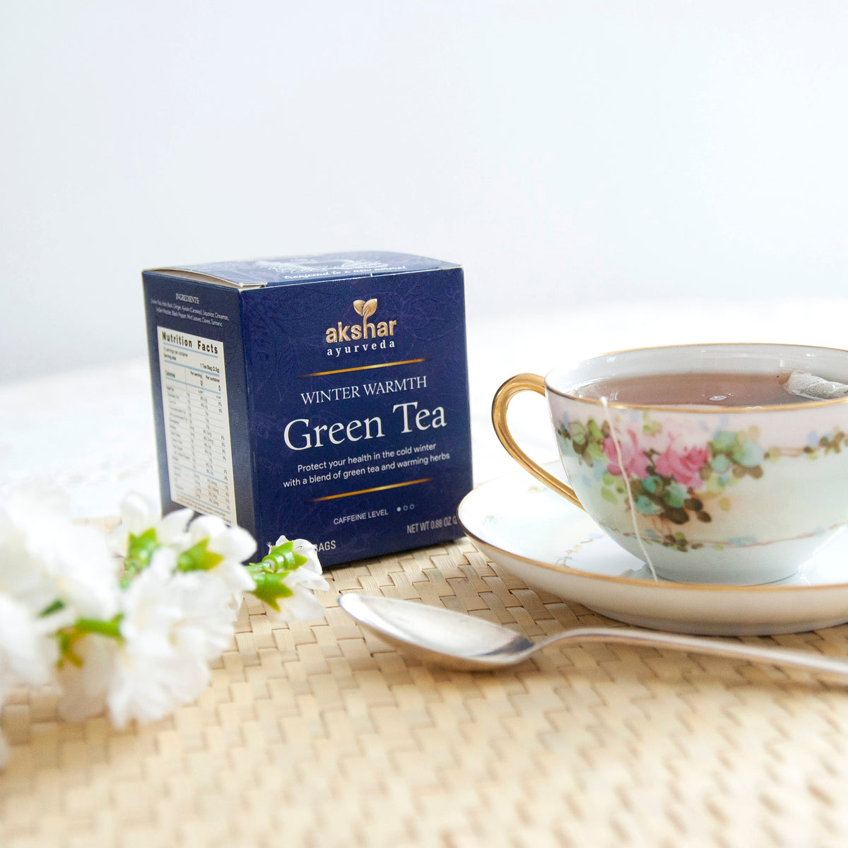 Akshar Ayurveda Winter Warmth Green Herbal Tea, 10 tea bags brewed tea product lifestyle image