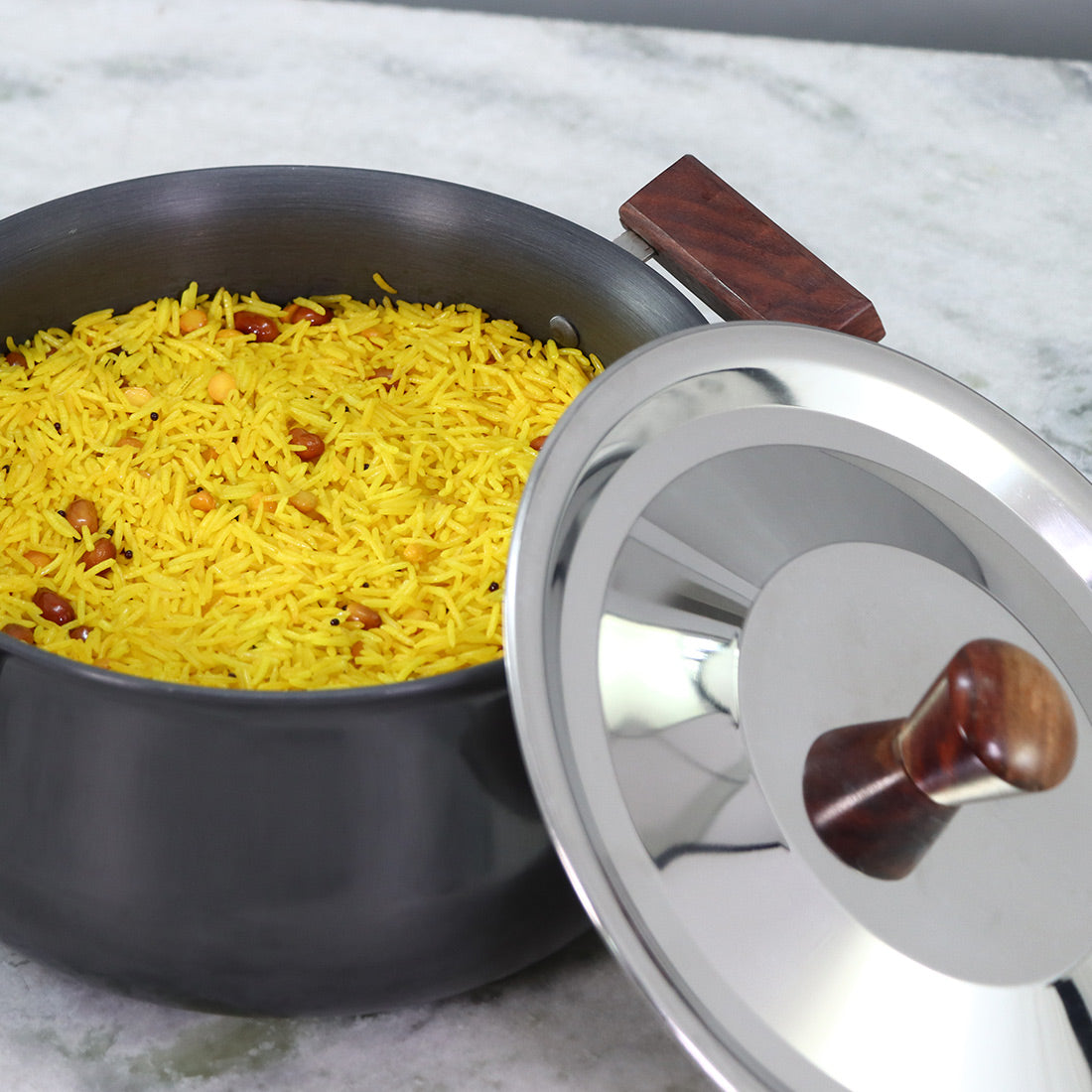 Wonderchef Ebony Hard Anodized PFOA-Free Handi Pot with Lid and Handles 21cm, Black, shown with food